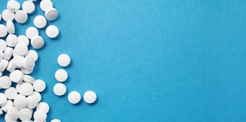 Digitalmedien Kosmetik und Gesundheitsprodukte - blauer Hintergrund, weiße Pillen